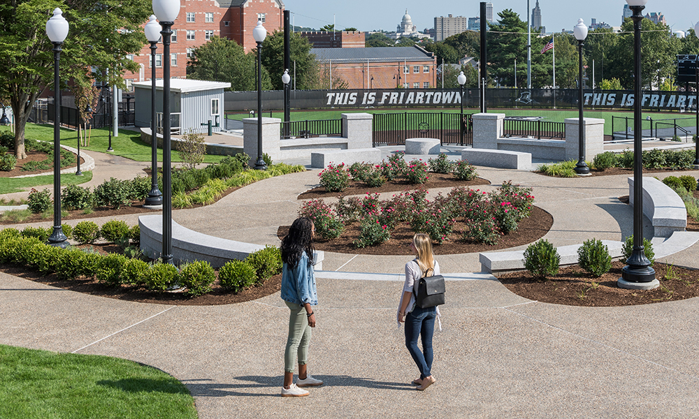 <p>The Capital View Overlook, located at a major pedestrian crossing, offers vistas of the Rhode Island State House creating a dynamic place where the campus community crosses paths and a chance to rest, view a softball game, or gather for informal activities.</p>
