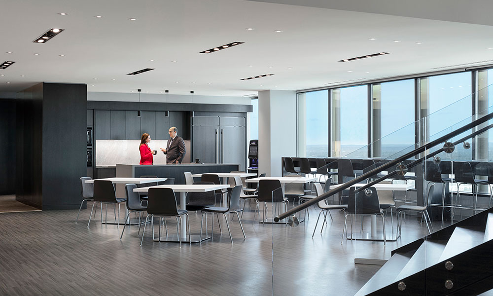<p>The stair connects the reception area on the 26th floor, to a spacious, well-appointed café on the 25th floor. Bright and comfortable, the café provides employees a central space in which to engage and host both casual interactions and large communications sessions.</p>
