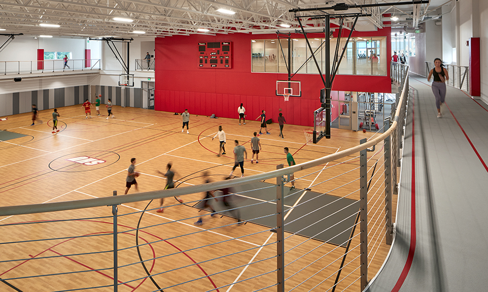 <p>A multi-purpose sport court surrounded by a suspended running track circling the building’s perimeter.</p>
