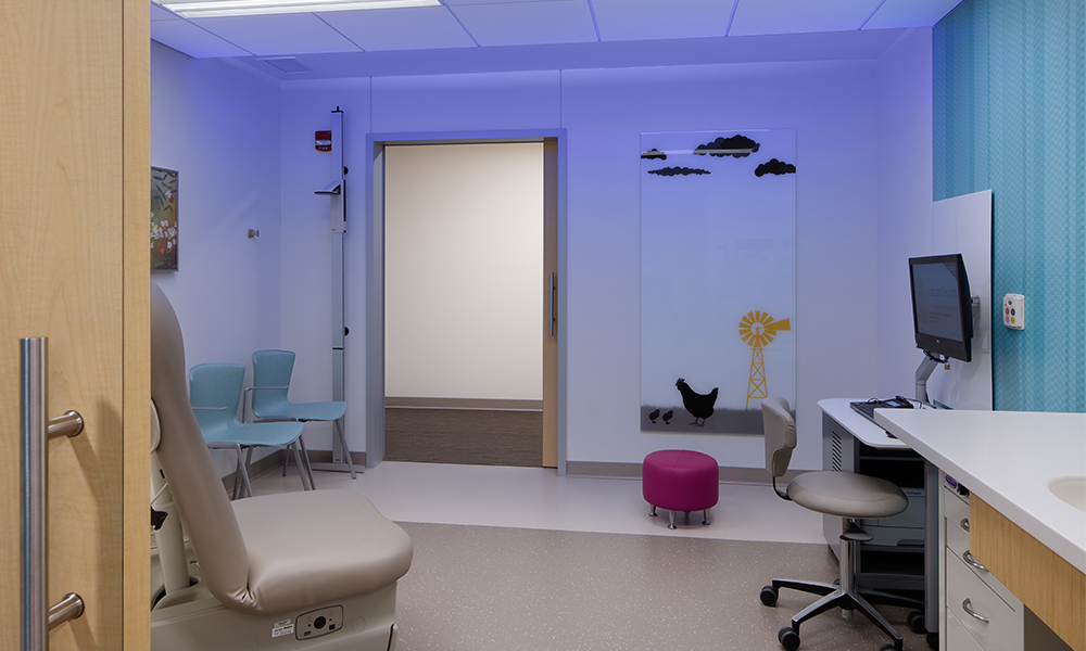 <p>State-of-the-art distraction elements in the 54 exam rooms include controllable color lighting, markerboards with graphics, and child-friendly furniture.</p>
