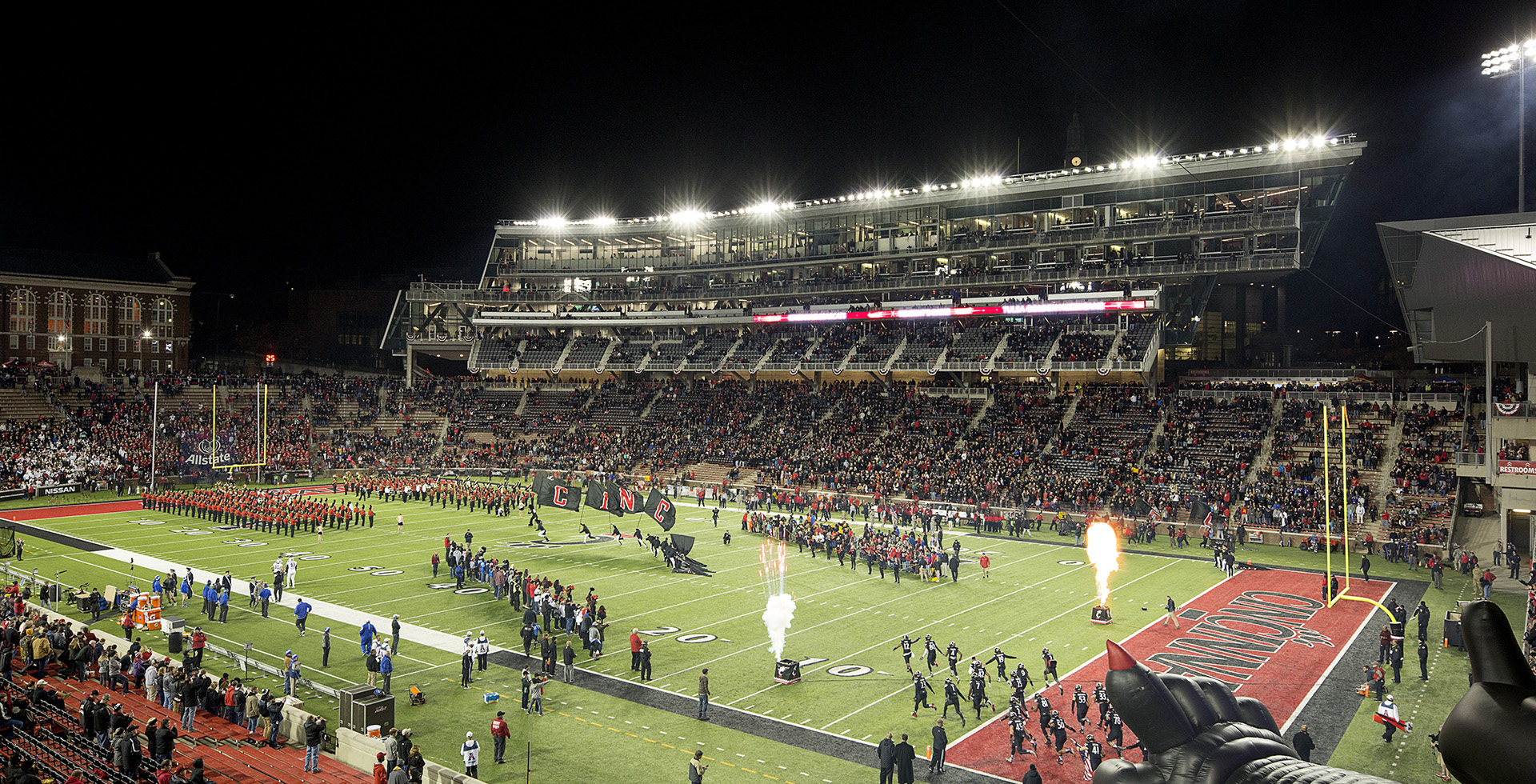 <p>Gameday! Cincinnati Bearcats taking the field with Nippert Stadium filled with cheering fans.</p>
