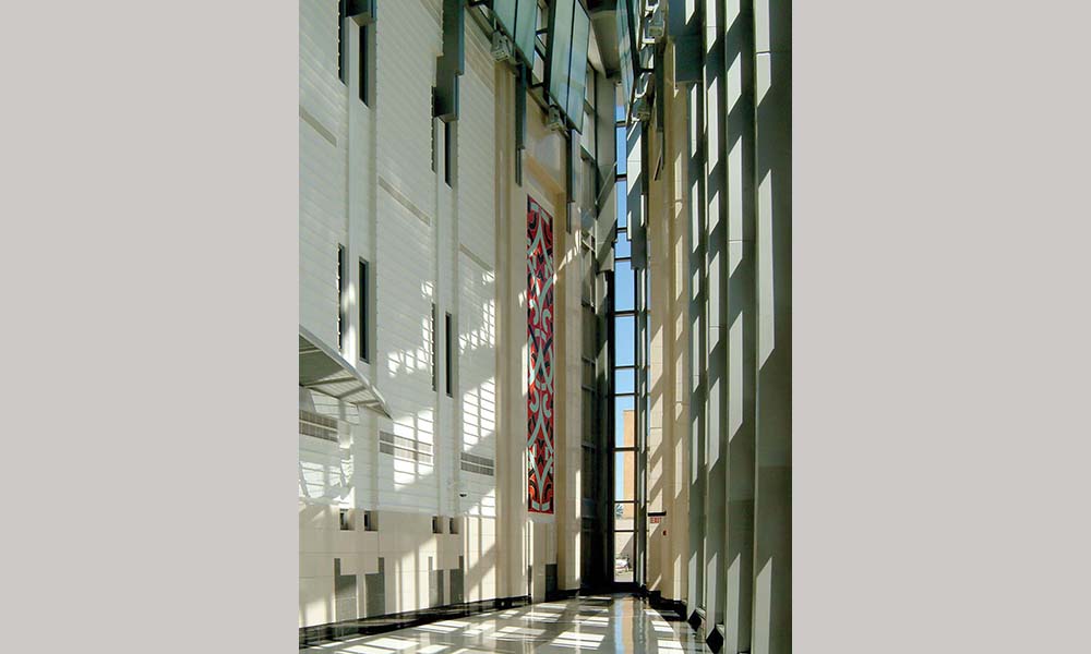 <p>An elongated oval foyer connects the two entrances to the building lobby inside. This 3 1/2 story lobby creates a heroic sense of arrival with its gothic proportions and clerestory lighting at the top.   </p>

