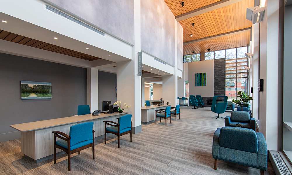 <p>The new surgery center registration entry hall welcomes patients and their families with soothing materials, colors and natural light.</p>

