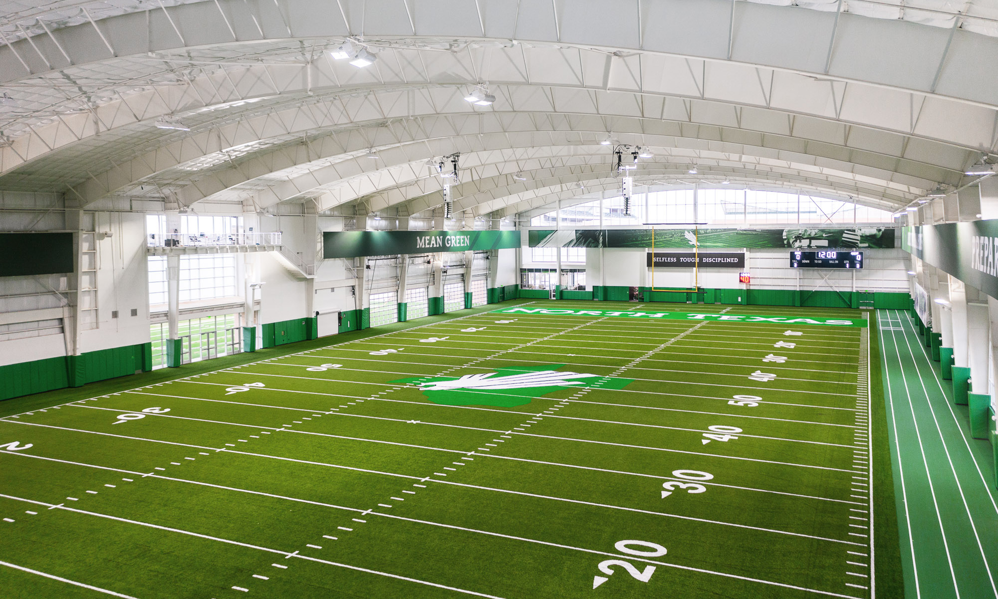 <p>At Approximately 94,300 GSF, the Indoor Practice Facility includes an artificial turf field and a three-lane track with runoff for athletes to decelerate after sprinting.</p>
