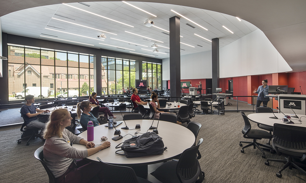 <p>The active learning cabaret classroom allows for groups of students and faculty members to breakout and collaborate within the room.  Each round group table is outfitted with microphones and technology to promote student engagement and collaboration. </p>
