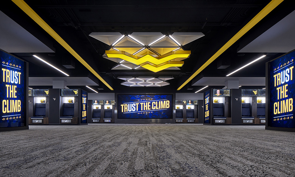 <p>Modern design and expansion of the locker room and team lounge offers wider lockers, enhanced technology integration, fresh branding and graphics, and an intensified “wow” factor for the recruiting path.</p>
