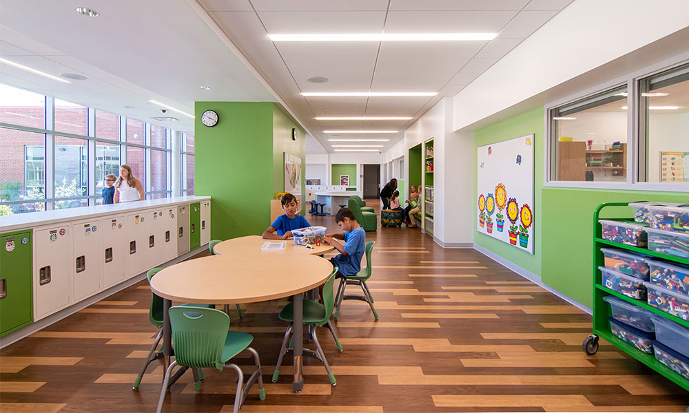 <p>The Learning Commons is lined with appropriately-sized lockers, increasing space within the classrooms by eliminating the need for cubbies.</p>
