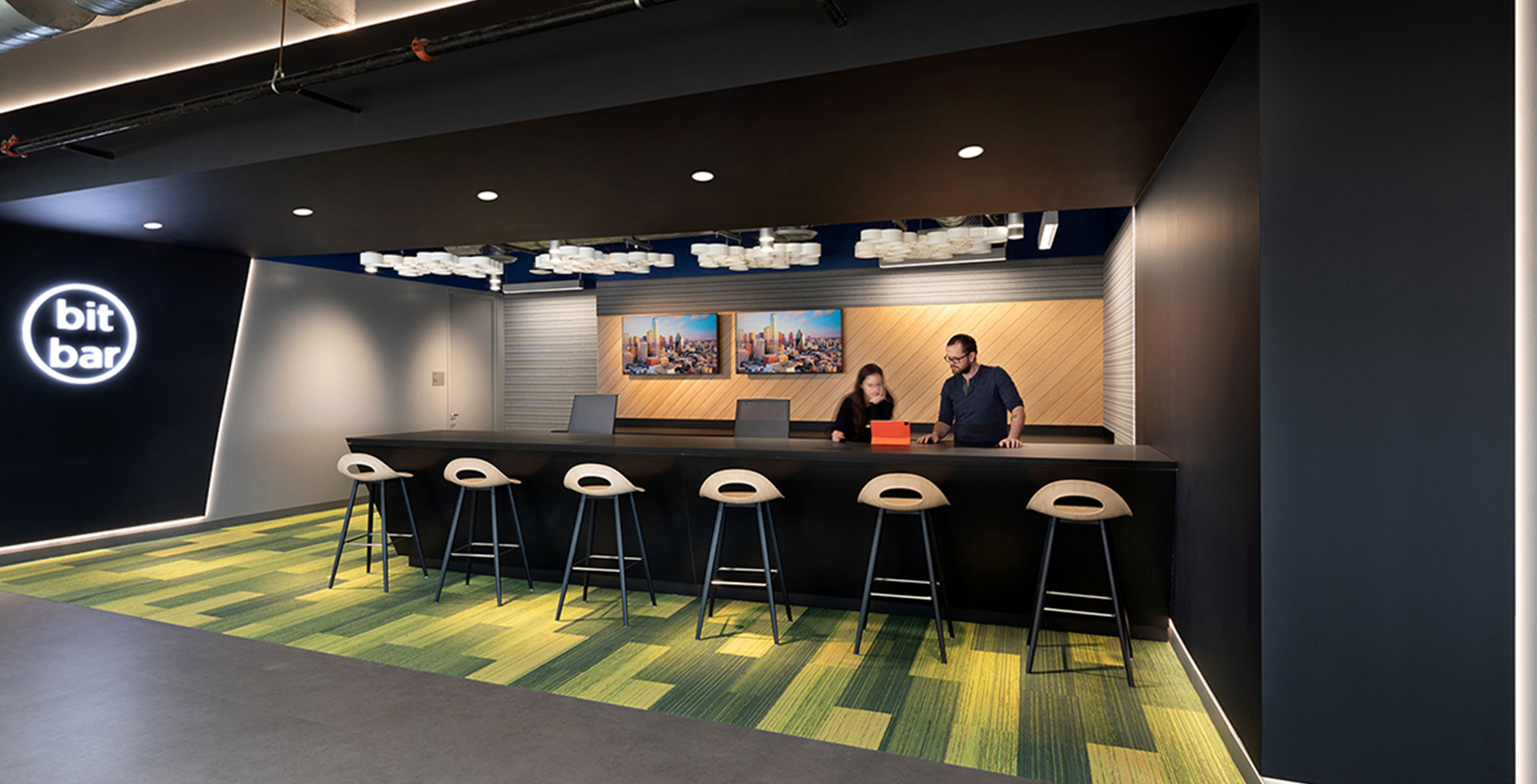 <p>The Bit Bar is a branded name for Vistra’s genius bar technology services on demand kiosk. The intentional bold design emphasizes the space as a beacon for tech help on the third floor landing of the monumental atrium stair.</p>
