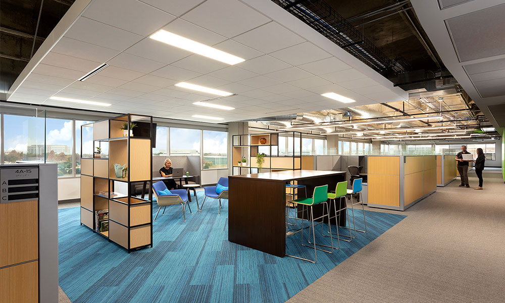 <p>Open collaboration areas interspersed within workstations allow for employees to gather for quick meetings, collaboration or even just a change in posture throughout the day. Business units were able to select from a couple different furniture options to support how they work best.</p>
