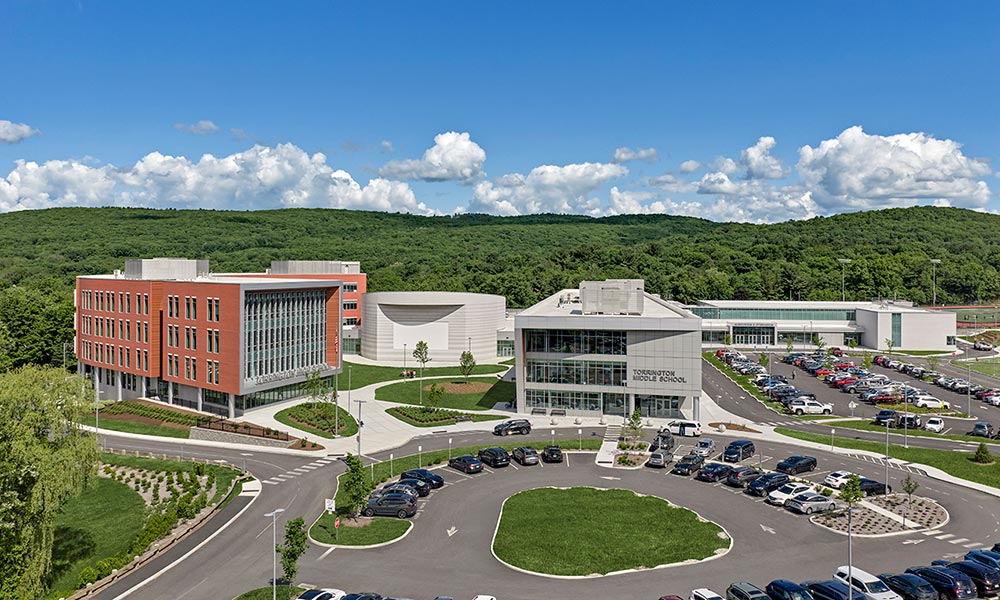 <p>Entry to the new middle school and high school begins at Besse Park, terminating at safe and defined circulation for pedestrians stemming from separate loops for school bus and parent drop-off.</p>
