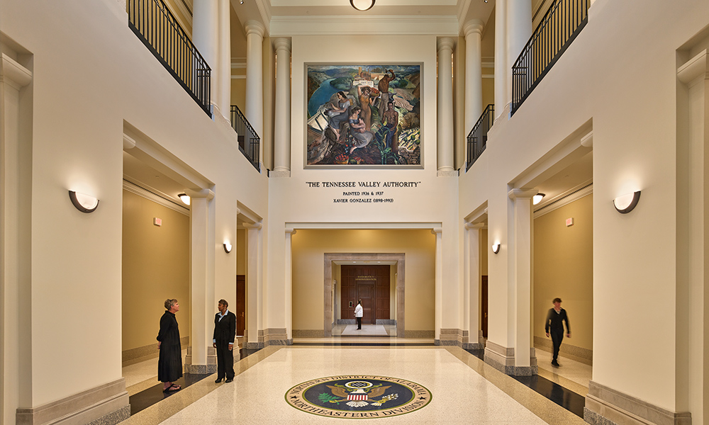 <p>The central atrium features a WPA era mural by Xavier Gonzalez which was moved from the historic courthouse.</p>
